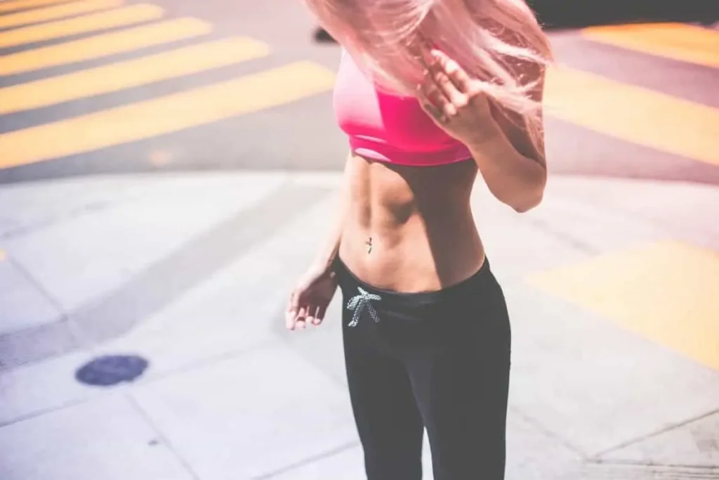 Woman with toned stomach after LA-EMS Body Sculpting Treatment Worcester Park